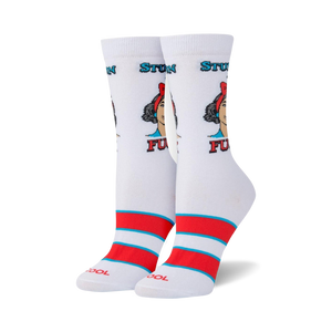 A pair of white socks with a red and blue striped cuff. The socks have a repeating pattern of a woman's face with the words 