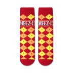 Close-up showing the texture of the Cheez-It Fuzzy socks. The fuzzy red and yellow checkered pattern is clearly visible.