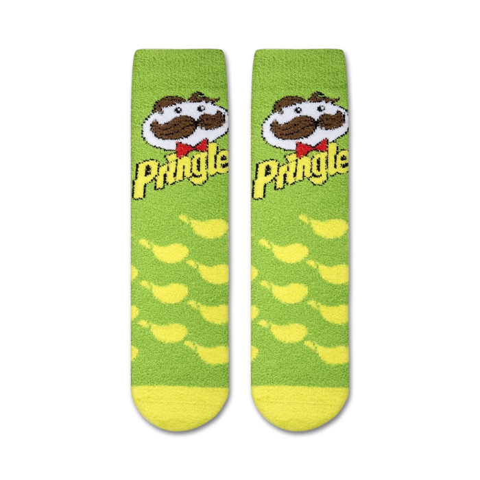 A pair of green socks with a Pringles logo on each sock. The logo includes the word 