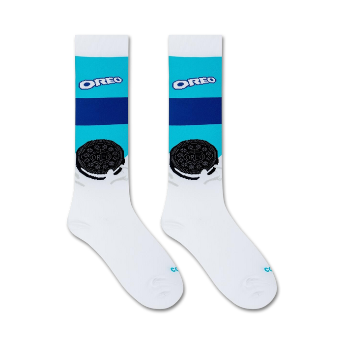 A pair of white socks with blue and turquoise stripes and an Oreo cookie graphic on each sock.