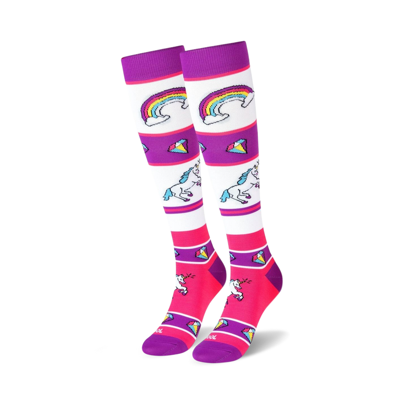 Pair of knee-high socks with white, purple, and pink stripes. Design includes unicorns, rainbows, and colorful gems.