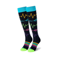 Pair of black knee-high socks with colorful heart rate monitor and rainbow stripe designs.  Teal cuffs and lime green soles.