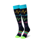 Pair of black knee-high socks with colorful heart rate monitor and rainbow stripe designs.  Teal cuffs and lime green soles.