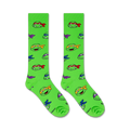 Flat lay image showing two TMNT knee-high socks on a white background.