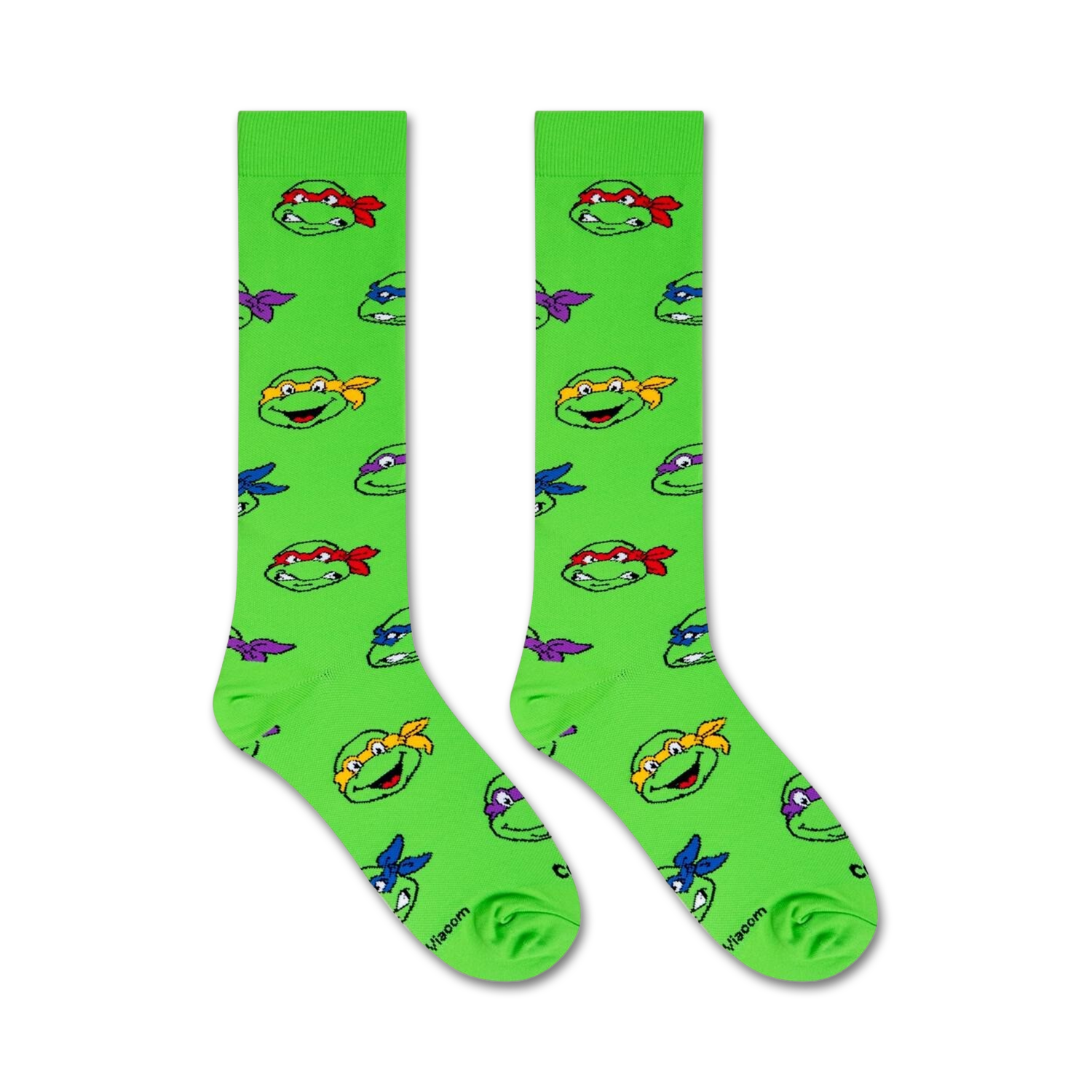 Flat lay image showing two TMNT knee-high socks on a white background.