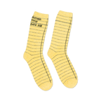 Close-up detail shot of the yellow library card socks, highlighting the texture and design.
