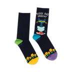 Pair of navy blue crew socks with Pete the Cat reading a book, yellow sunflowers, and colorful accents. 