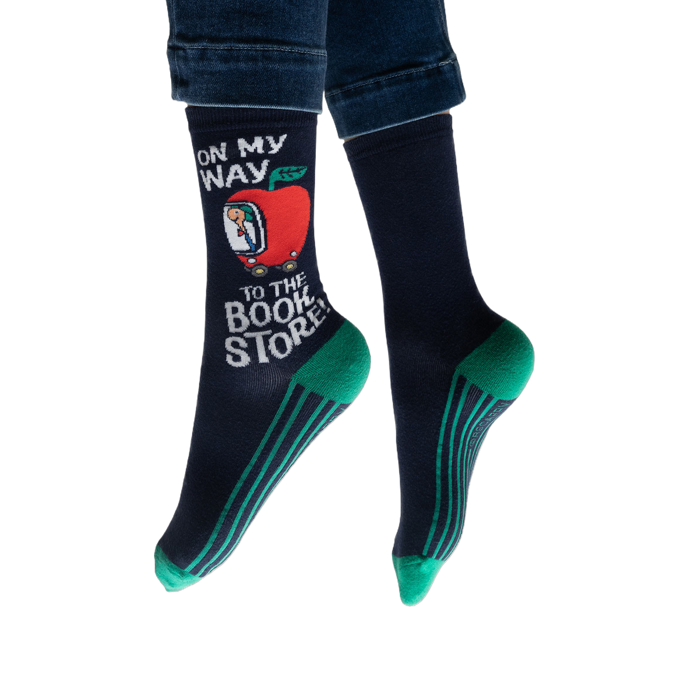 Lifestyle shot: Person wearing navy blue socks with teal stripes and a Richard Scarry apple car design.