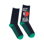 Close-up of the Richard Scarry apple car design on the navy blue socks with teal stripes.