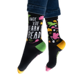 Flatlay image showing both socks laid flat, showcasing the full design.