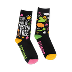 Pair of black crew socks with a colorful design featuring the quote "Once you learn to read" and whimsical illustrations. Yellow, pink, and green accents.