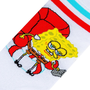 A white sock with a red and blue striped cuff. The sock features a cartoon character, SpongeBob SquarePants, sitting on a red armchair.