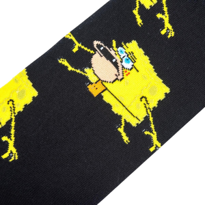 A black sock with a pattern of a yellow cartoon character, SpongeBob SquarePants, doing the 