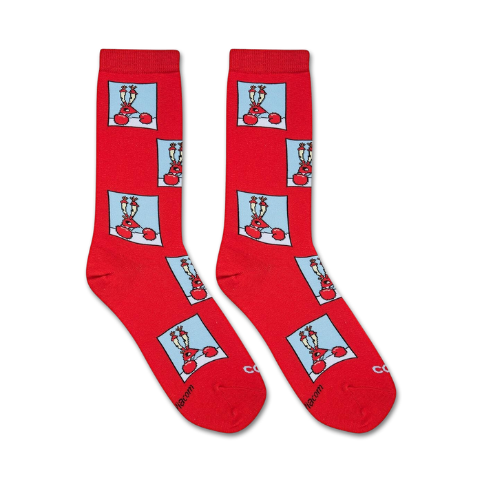 A red sock with a repeating pattern of a blue square with a cartoon crab on it.