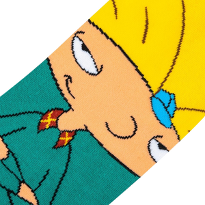 A yellow cartoon character with spiky hair from the 1990s Nickelodeon cartoon Hey Arnold!