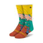 Crew socks featuring Arnold Shortman from Hey Arnold! in teal, yellow, and red. The socks feature Arnold's face and the word 'Arnold' repeated.