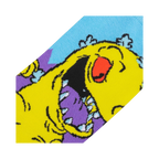 Close-up detail shot of the Reptar design on the Rugrats socks, showing the texture and colors.
