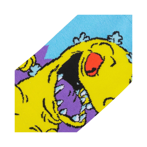 Close-up detail shot of the Reptar design on the Rugrats socks, showing the texture and colors.