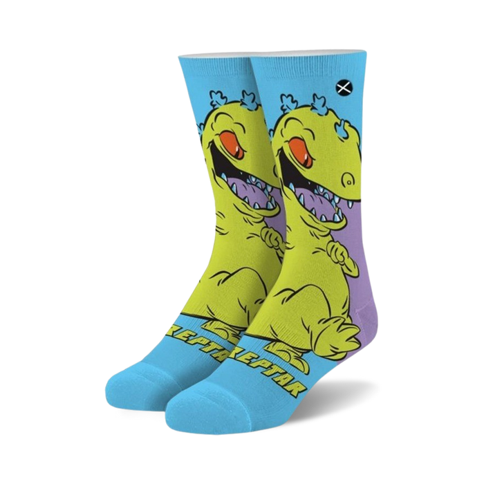 blue crew socks adorned with the green reptar dinosaur from rugrats with purple hair and orange eyes.  