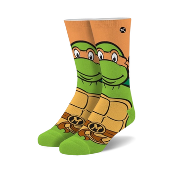 orange and green crew socks featuring michelangelo from teenage mutant ninja turtles; available for men and women.   