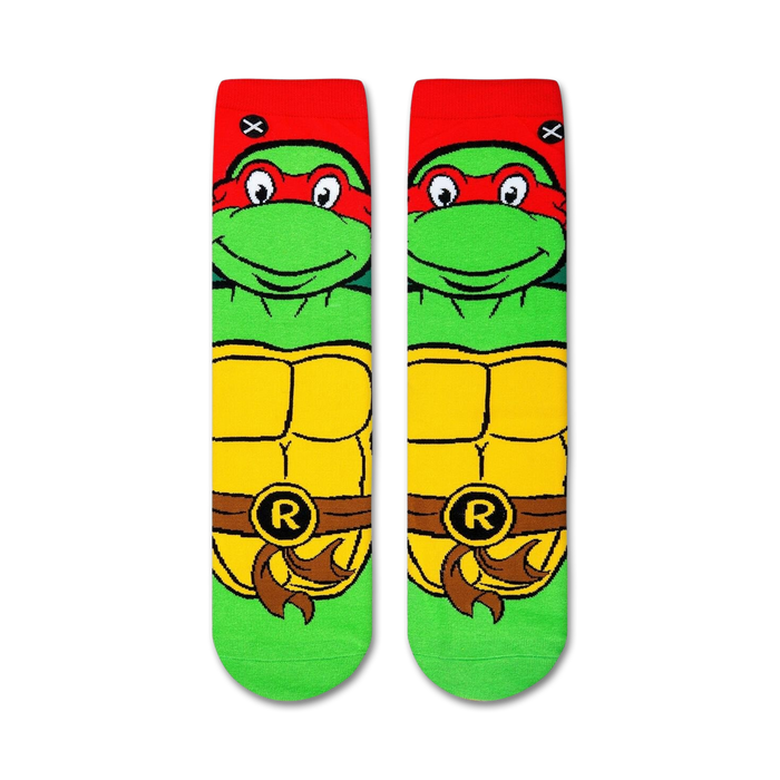 A pair of green and red socks with the Teenage Mutant Ninja Turtles on them.