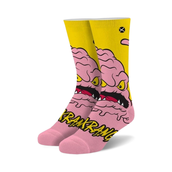 pink and yellow crew socks featuring cartoon character krang from teenage mutant ninja turtles.   
