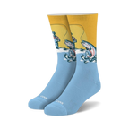 Pair of men's crew socks. Yellow and light blue design. Features a vintage illustration of a fisherman catching a trout.
