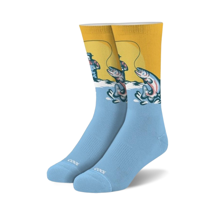 light blue fishing crew socks feature a fisherman wearing a red hat and blue overalls standing in a river fishing, with the word 
