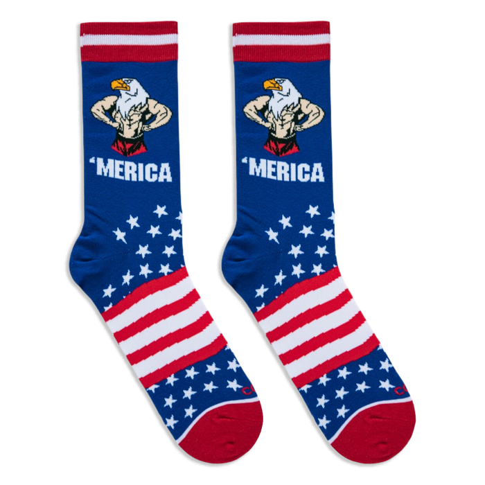 Flat lay of two blue 'Merica socks side by side, clearly showing the muscular flexing eagle, bold text, stars, and stripes.