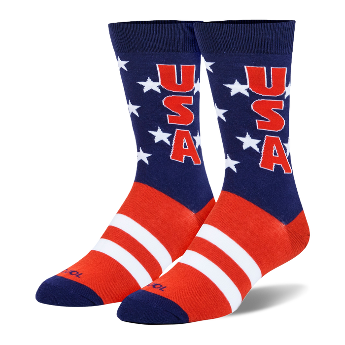 Crew socks with a navy blue leg, white stars, red USA text, and bold red and white stripes covering the foot area. }}