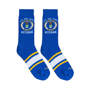 Flat lay of royal blue crew socks showing the U.S. Air Force seal, Veteran text, and athletic foot stripes.