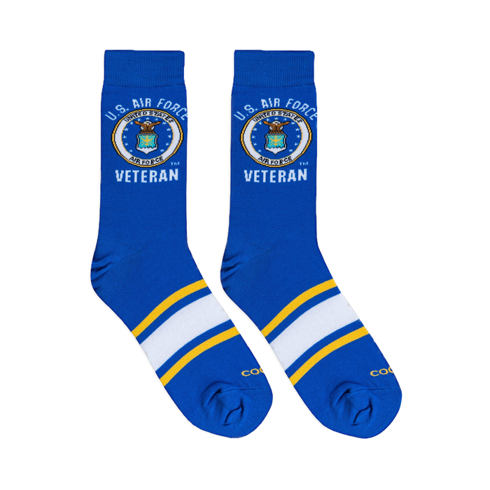Flat lay of royal blue crew socks showing the U.S. Air Force seal, Veteran text, and athletic foot stripes.