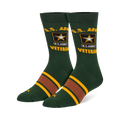 Dark green crew socks featuring yellow U.S. Army Veteran text, the Army star logo, and brown and yellow stripes on the foot.