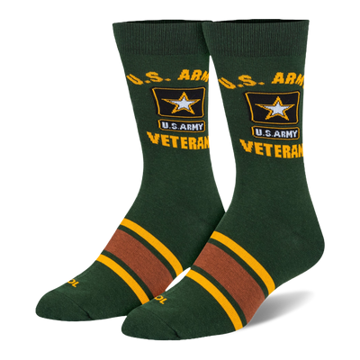 Dark green crew socks featuring yellow U.S. Army Veteran text, the Army star logo, and brown and yellow stripes on the foot.