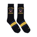 Flat lay of two black crew socks showing the U.S. Navy Veteran eagle design on the leg and yellow and blue foot stripes.