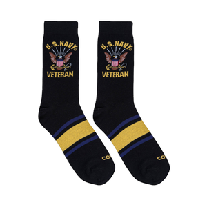 Flat lay of two black crew socks showing the U.S. Navy Veteran eagle design on the leg and yellow and blue foot stripes.