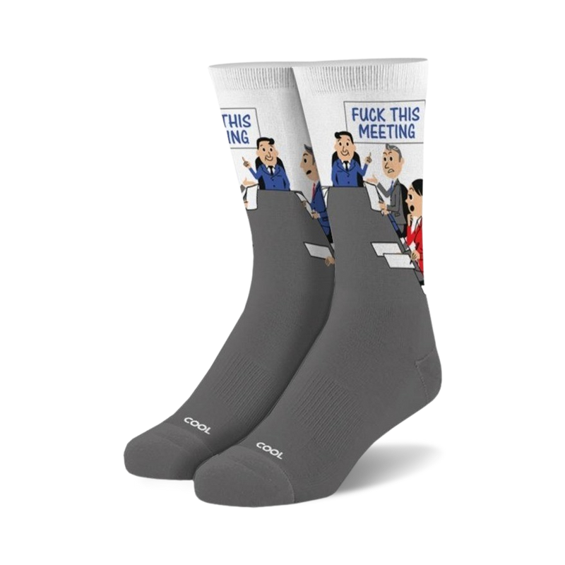 Gray crew socks with a white panel featuring a cartoon of a meeting with the words 'Fuck This Meeting'.  The socks have 'COOL' subtly printed on the bottom.
