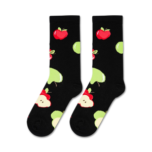 A black background with a pattern of red and green apples.