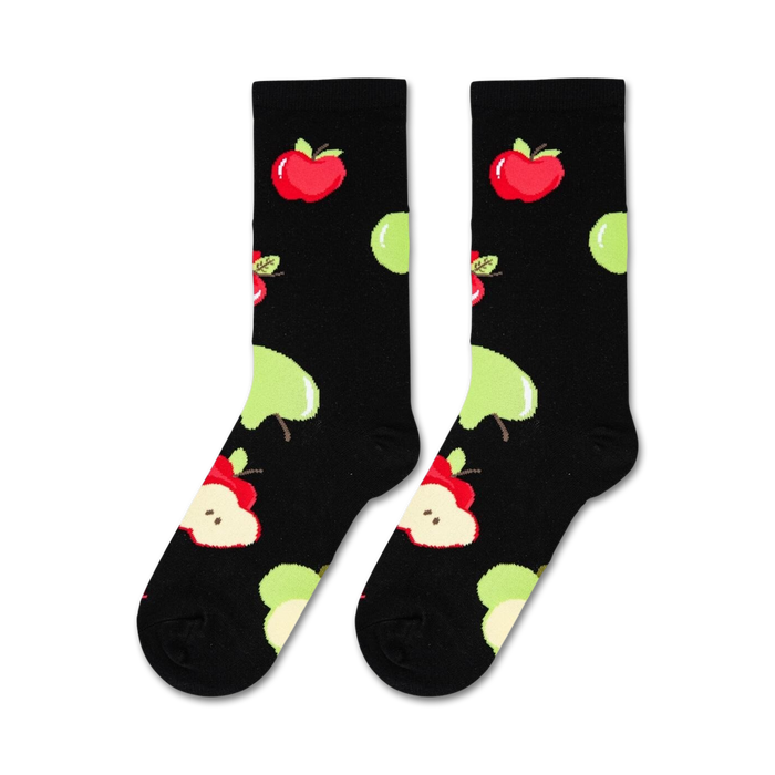 A black background with a pattern of red and green apples.