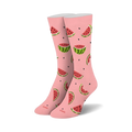 Pair of pink crew socks with a whimsical watermelon print.  Watermelon slices and seeds are scattered across a light pink background.
