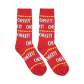 Close-up view of two Cheez-It-patterned socks against a plain background.