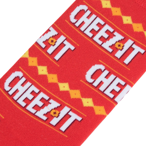 A red sock with white and yellow repeating text that reads 