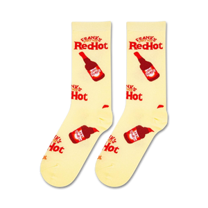 A yellow sock with a red bottle of Frank's RedHot sauce on it.