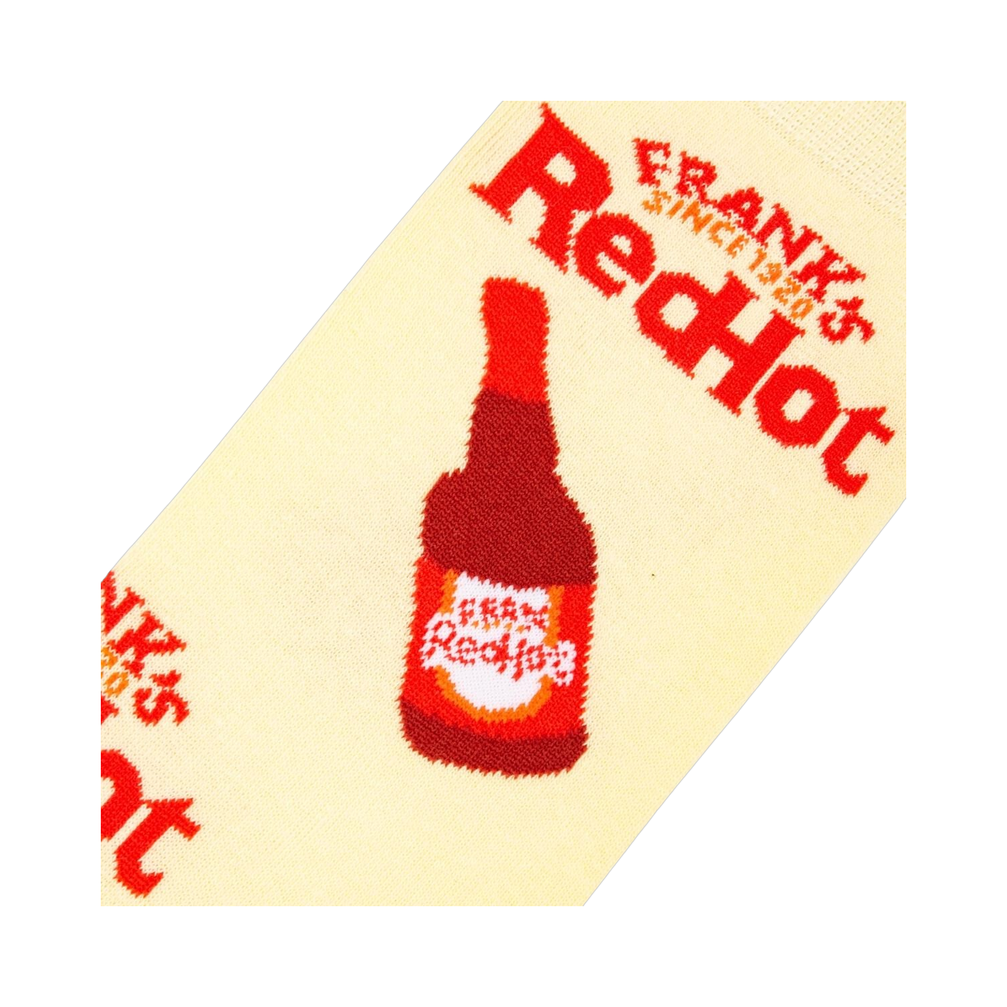 Close-up detail shot of a Frank's RedHot bottle graphic on a cream-colored sock.