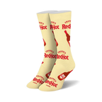 Pair of cream-colored crew socks with repeating Frank's RedHot logo and bottle illustrations. Red and cream color scheme.