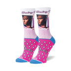 Pair of women's crew socks. Primarily white with pink and blue accents. Features Johnny Depp's Cry-Baby image and a pink teardrop pattern.