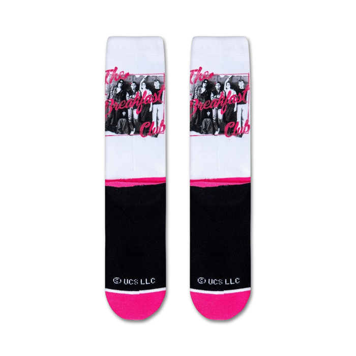 A white cotton headband with a sublimated image from the movie The Breakfast Club. The image is of the five main characters in the movie, standing in front of lockers. The headband has a pink border and the words 