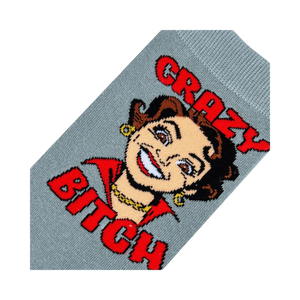 Close-up detail shot focusing on the cartoon woman's face and 'Crazy Bitch' text on the sock.