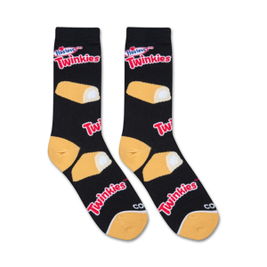 A pair of black socks with an allover pattern of Hostess Twinkies snack cakes in yellow and white. The word 