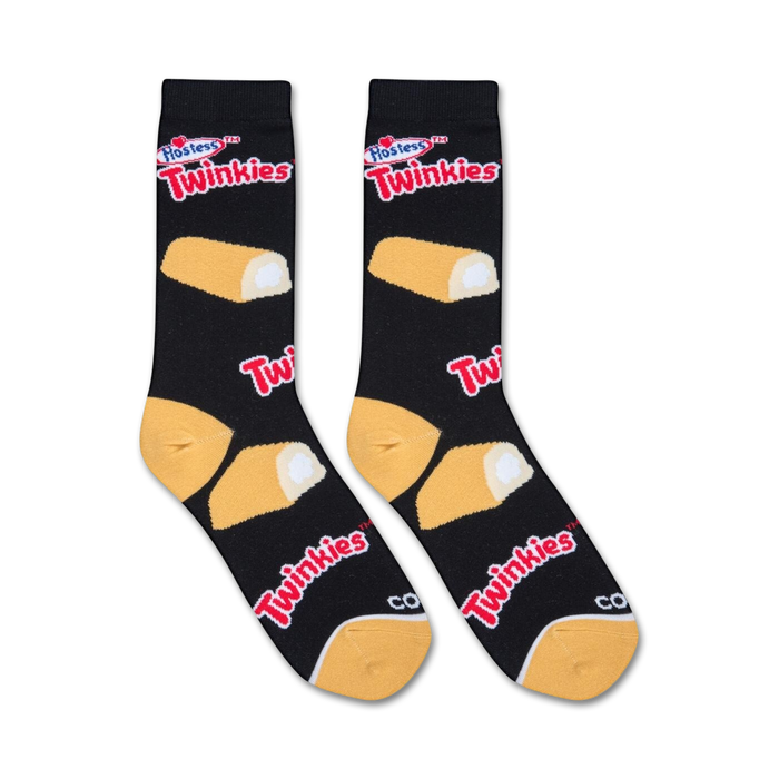 A pair of black socks with an allover pattern of Hostess Twinkies snack cakes in yellow and white. The word 